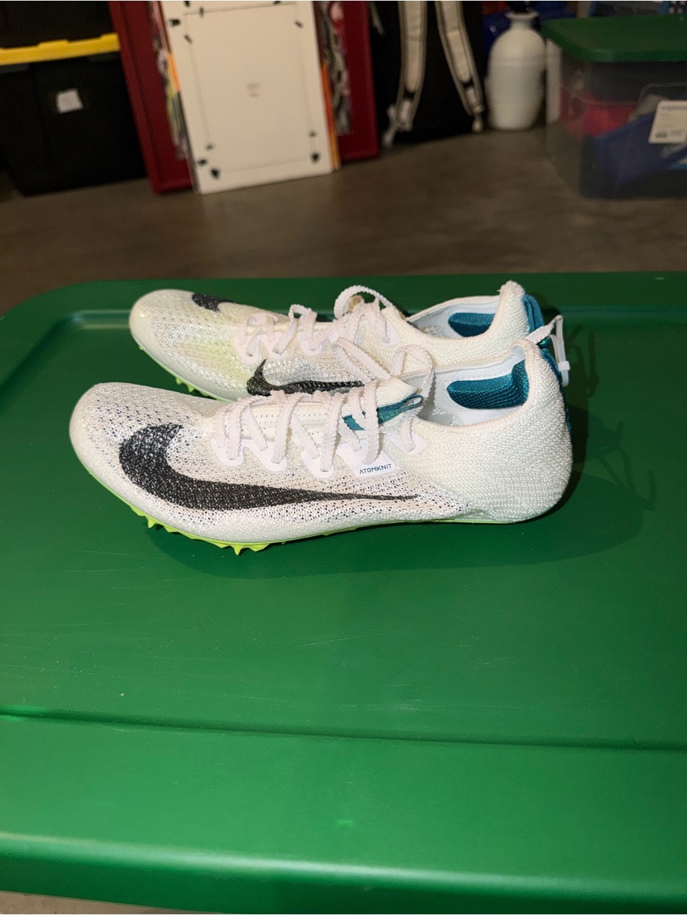 White Nike track spikes